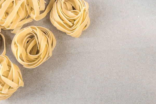 stock image Background with raw spaghetti. View from above. Space for text.