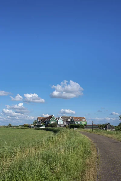 Characteristic houses of the hamlet Courts south of the canal on the island of Marken. Province of North Holland in the Netherlands
