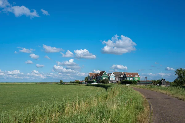 Characteristic houses of the hamlet Courts south of the canal on the island of Marken. Province of North Holland in the Netherlands