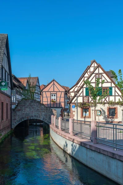 stock image Annweiler, Germany - August 27, 2021: Ensemble at the Schipkapass in Annweiler with the Queich river and remains of the old town wall, Palatinate region in the state of Rhineland-Palatinate in Germany