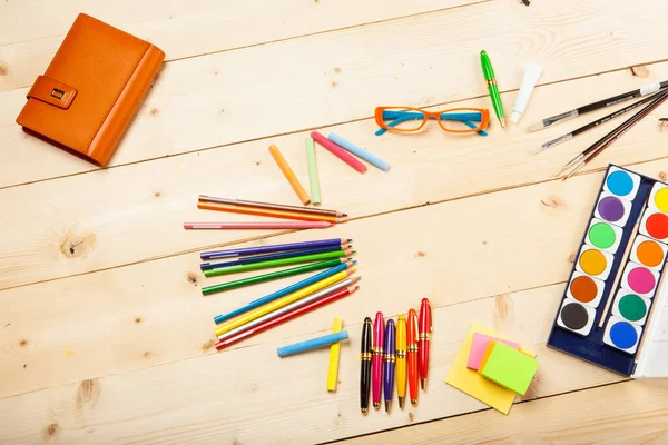 Watercolors Pencils Pens Post Its Wooden Tabletop — Stock Photo, Image