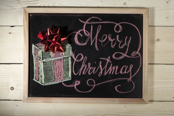 stock image Black chalkboard on wooden background with the inscription: 