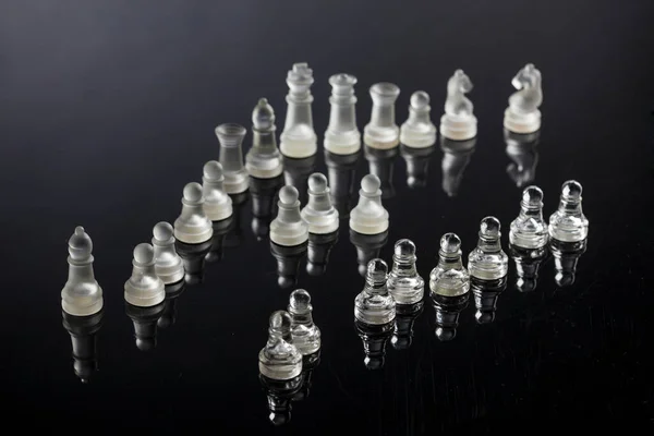 Glass Chess Pieces Arranged Dark Transparent Surface — Stock Photo, Image