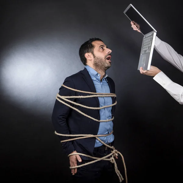 Man Desperate Suit Screams Tied Rope Chair Isolated Black Background — Stock Photo, Image