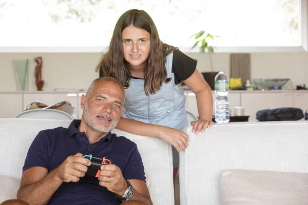 Father Daughter Enjoy Playing Electronic Game While Sitting Sofa Living — Stock Photo, Image