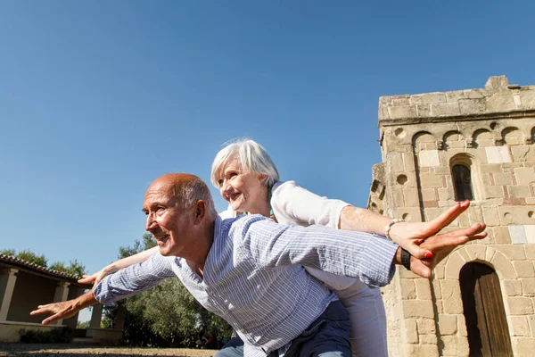 Happy Elderly Couple Embrace Each Other Smiling Takes Pony Her — Stock Photo, Image