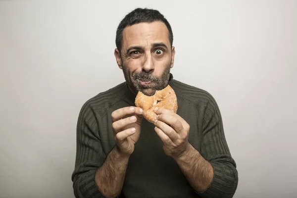 stock image man with pastries on white background  