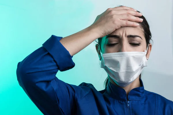 Doctor Blue Coat White Mask Holds His Head Despair Green — Stock Photo, Image