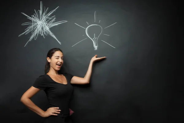 Beautiful Girl Winking Expression Points Drawing Light Bulb Blackboard — Stock Photo, Image