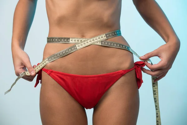 Girl Red Bikini Turns Measuring Tape Her Waist Take Exact — Stock Photo, Image