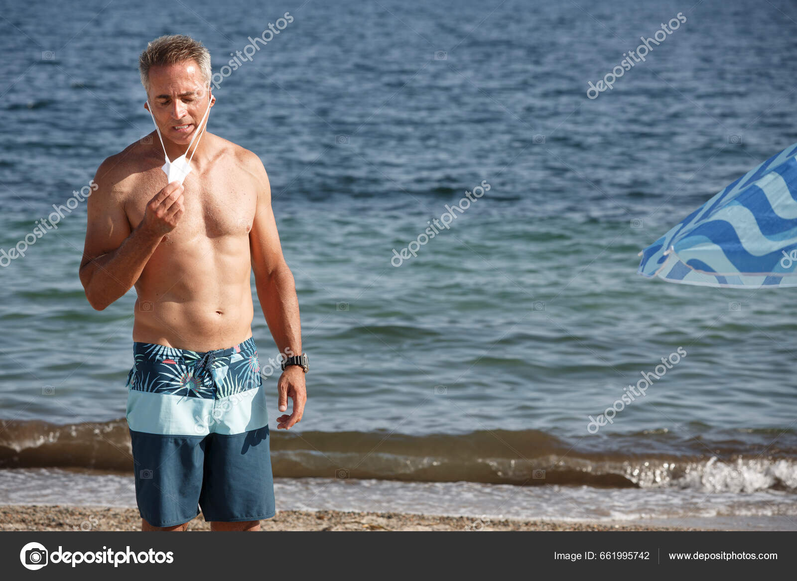 Shirtless Fifty Year Old Man Stands Beach Swimsuit While Taking — Stock  Photo © alesealesphoto #661995742