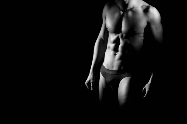 Muskulöser Mann Auf Schwarzem Hintergrund — Stockfoto