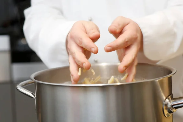 Chef Putting Noodles Pot Kitchen Closeup — Stock Photo, Image