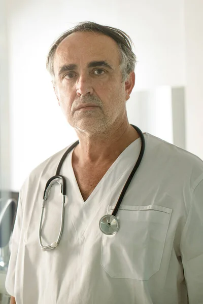 stock image Fifty-year-old doctor in a white coat