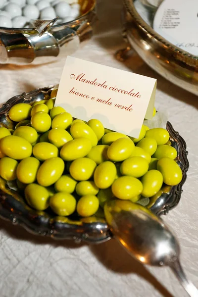 stock image table with delicious variegated sugared almonds elegantly displayed