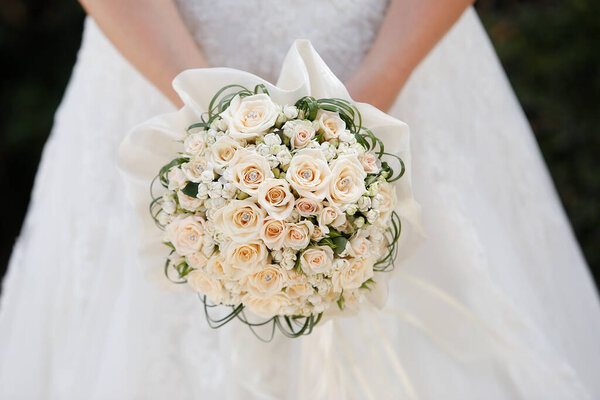 beautiful wedding bouquet in hands of the bride. 