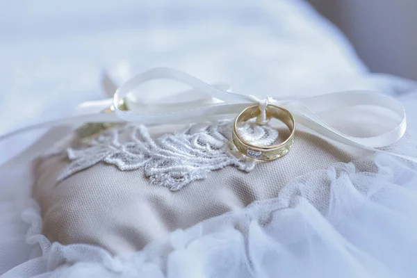 stock image close up of a wedding rings on pillow