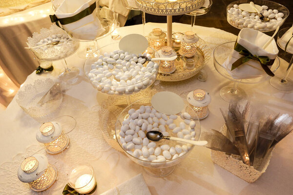 Wedding table set with candles and candies