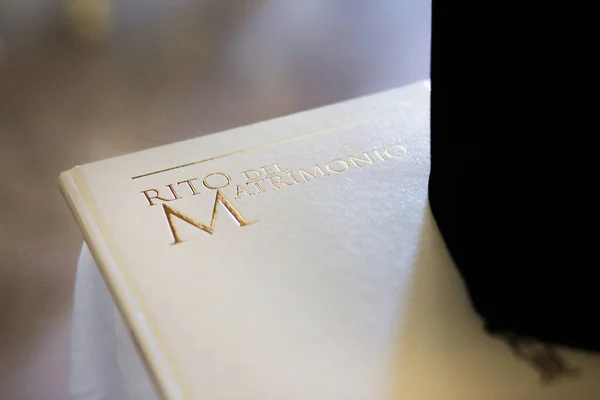close-up view of white wedding book