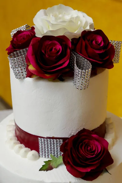 beautiful wedding cake with roses and wedding decoration. wedding concept