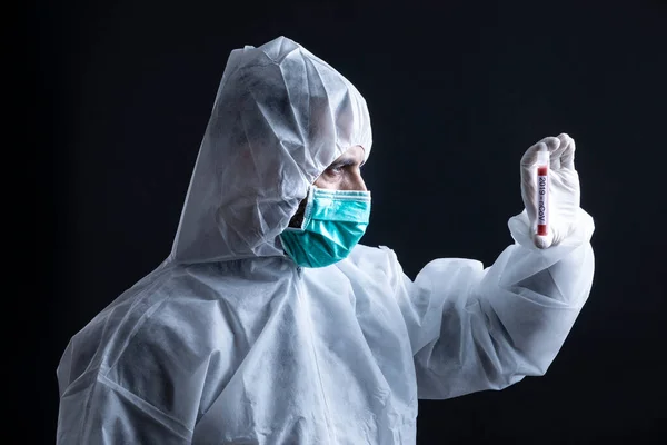 Doctor Protective Suit Mask Holding Tube Coronavirus Blood Test Black — Stock Photo, Image