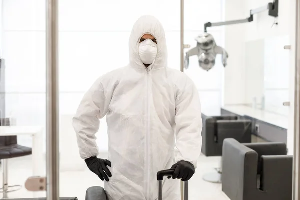stock image technician for sanitizing rooms equipped with equipment, he is preparing to sanitize a hairdressing salon