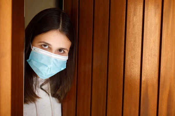 Girl Facial Mask Looks Sad Looking Out Front Door House — Stock Photo, Image