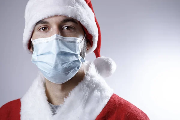 Young Man Santa Claus Suit Mask Grey Background — Stock Photo, Image