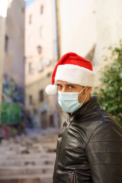 Man Santa Hat Leather Jacket Surgical Mask Looks Sad Urban — Stock Photo, Image