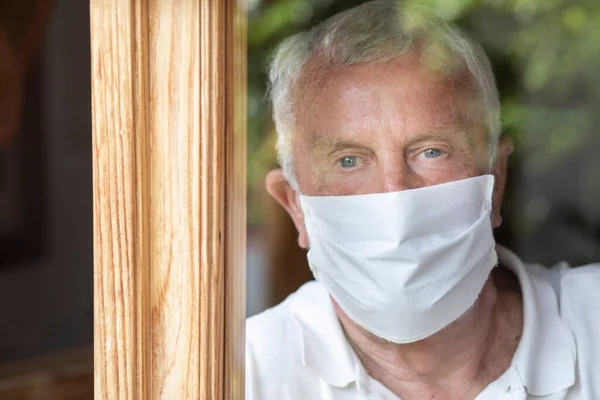 Senior Man Medical Mask Looking Out Window Home — Stock Photo, Image