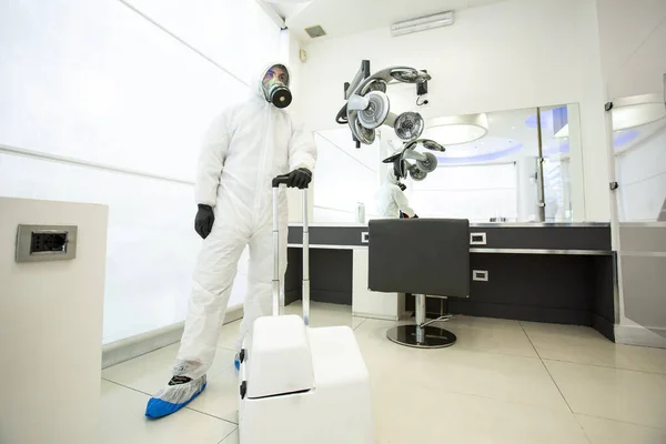 stock image Technician for the disinfestation of premises ready to use the specific machine to sanitize a hair salon