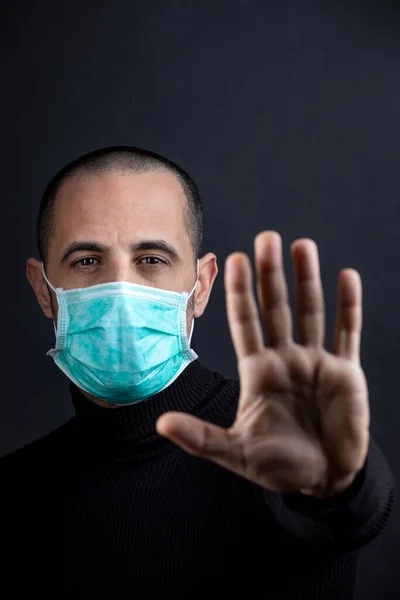 Man Shaved Hair Wearing Surgical Mask Black Sweater Imposes His — Stock Photo, Image
