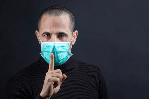 Man Shaved Hair Wearing Surgical Mask Black Sweater Brings His — Stock Photo, Image
