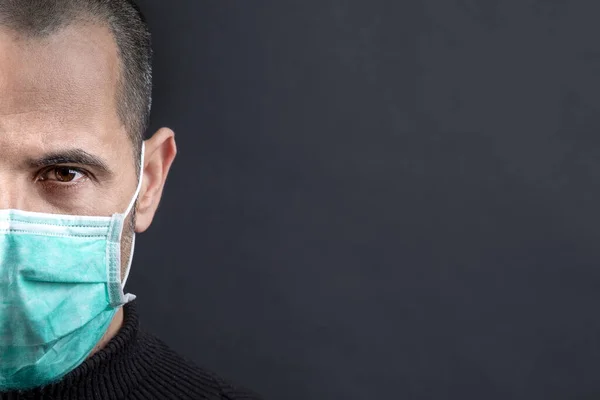 Close Portrait Man Wearing Green Surgical Mask Isolated Black Background — Stock Photo, Image