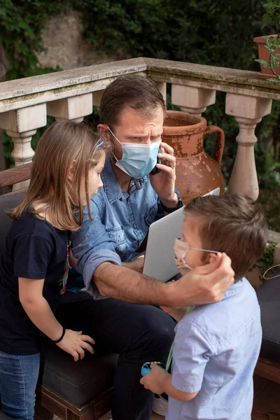 father working at home with children during quarantine