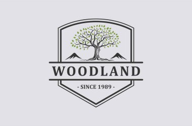 Woodland logo tasarımı premium vektörü