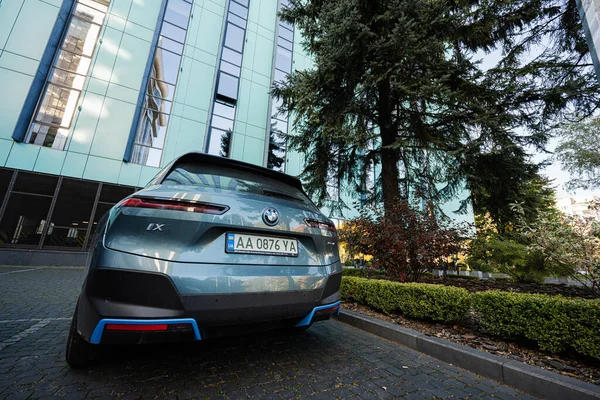 stock image Lviv, Ukraine - October 09, 2022: BMW iX on charging station. Car is a battery electric mid size luxury crossover SUV.