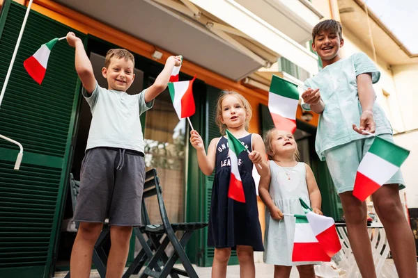 Happy Four Kids Italian Flags Celebrating Republic Day Italy Royalty Free Stock Images