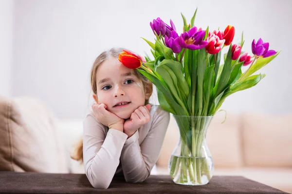 stock image Little girl with spring tulip bouquet.  Holiday decor with flowers colorful tulips. 