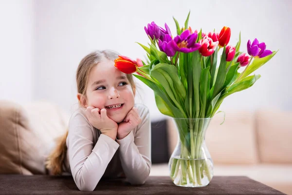 stock image Little girl with spring tulip bouquet.  Holiday decor with flowers colorful tulips. 