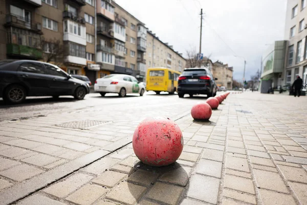 Parking limiter round ball. Car barriers, restriction of traffic in city.