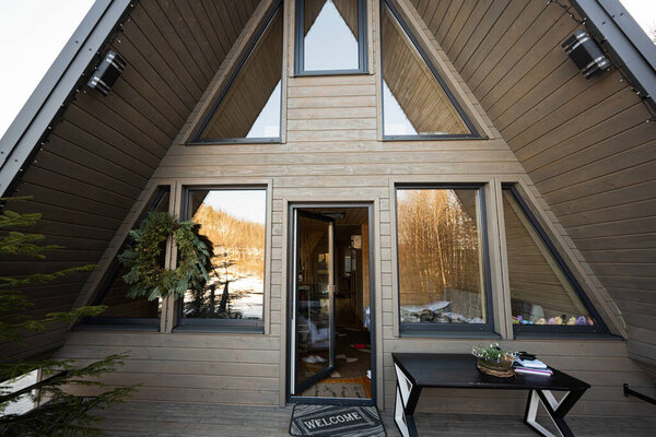 Triangle off grid tiny house in the mountains.