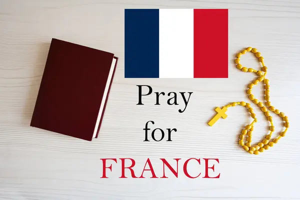 stock image Pray for France. Rosary and Holy Bible background.