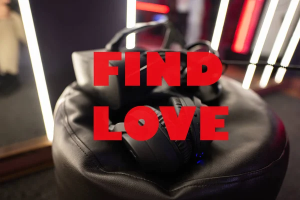 Find love concept. Professional headphones with microphone and vr glasses for video games and cyber sports on background.