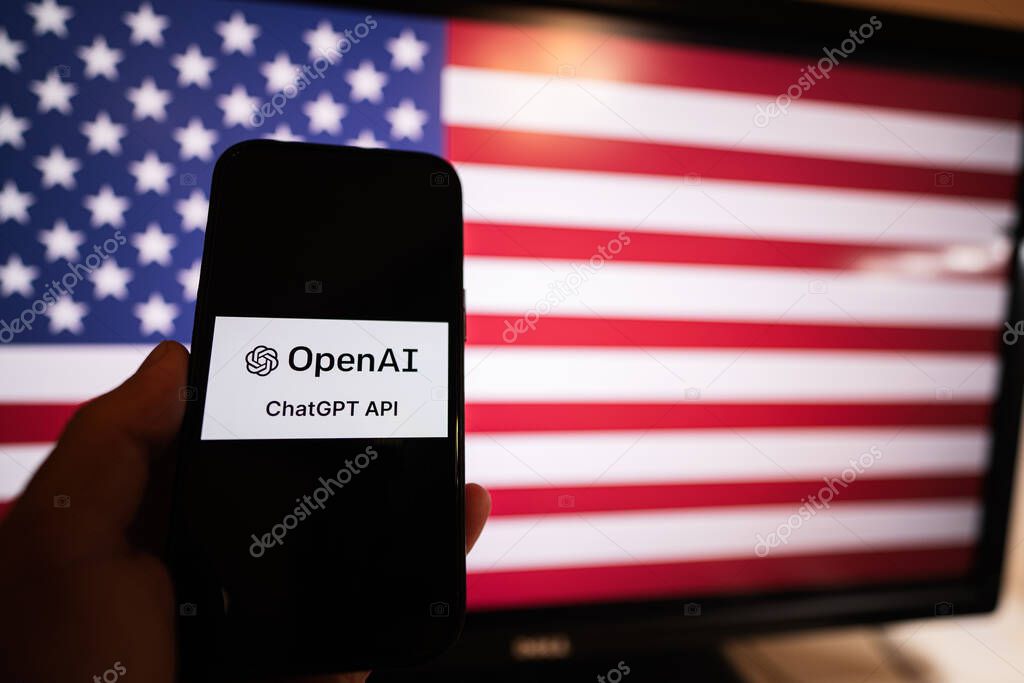 Kyiv, Ukraine - April, 2023: Hold smartphone with OpenAI Chat GPT against USA flag on screen.