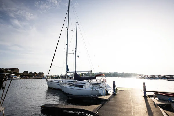 stock image Sailboat moored to a pier in the harbor at sunset Nessebar, Bulgaria.