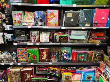 Kyiv, Ukraine - January 03, 2025: A display of colorful school supplies including decorative folders, binders, and stationery items. The shelves hold various creatively designed items suitable for students, presenting vibrant and inspiring choices in clipart