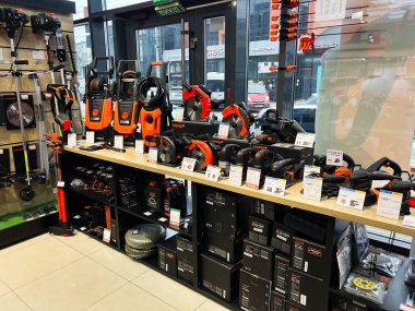 Electric power tools and accessories showcased prominently in a store's display area clipart