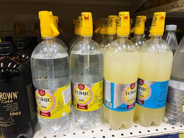 Kyiv, Ukraine - February 04, 2025: Selection of tonic waters and cola beverages displayed on a store shelf clipart