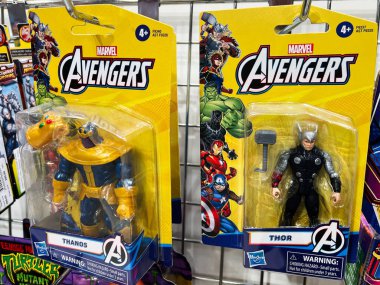 Kyiv, Ukraine - February 09, 2025: Action figures of Thanos and Thor in their original packaging at a store. clipart